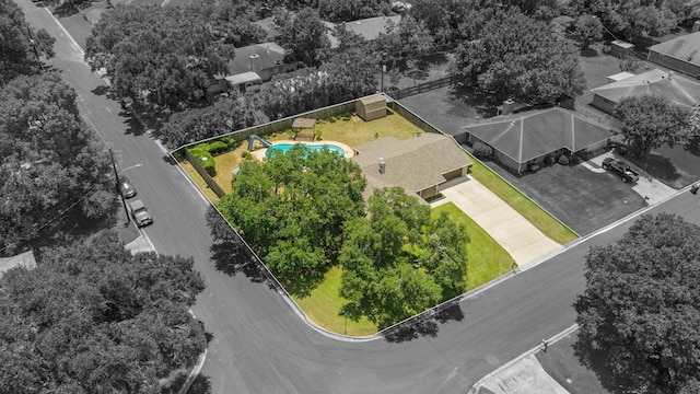 aerial overview of property's location featuring property parcel outlined and a pool area