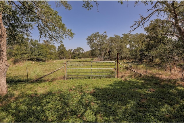 1651 Jdj Dr, New Braunfels, TX 78132 - gate with fence and a view of countryside