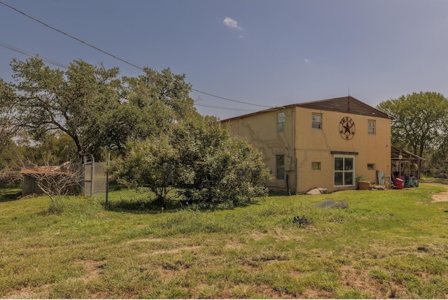 1651 Jdj Dr, New Braunfels, TX 78132 - back of house featuring a lawn and stucco siding