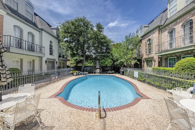 491 N Post Oak Ln Unit 491, Houston, TX 77024 - community pool with a patio area