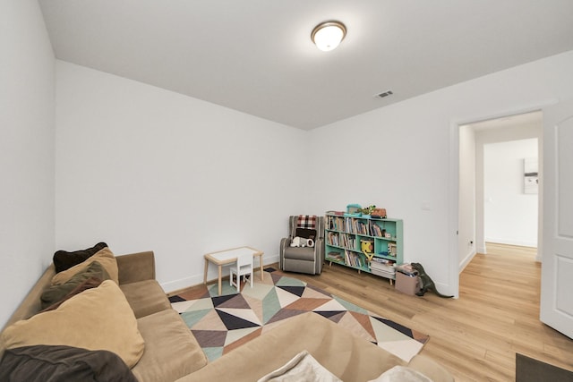 4914 Olive Province Ln, Manvel, TX 77578 - living area featuring light wood-style flooring and baseboards