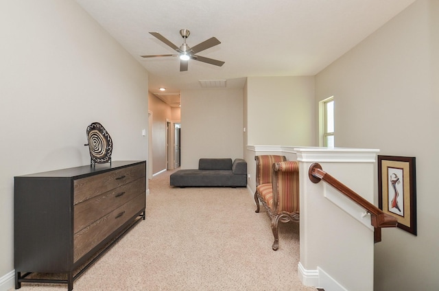 1913 Rosewood St, Houston, TX 77004 - sitting room featuring carpet, a ceiling fan, an upstairs landing, and baseboards