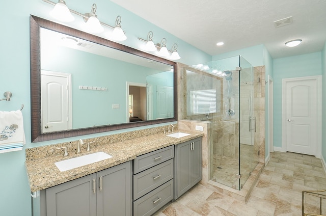 1913 Rosewood St, Houston, TX 77004 - full bath featuring a shower stall, double vanity, and baseboards