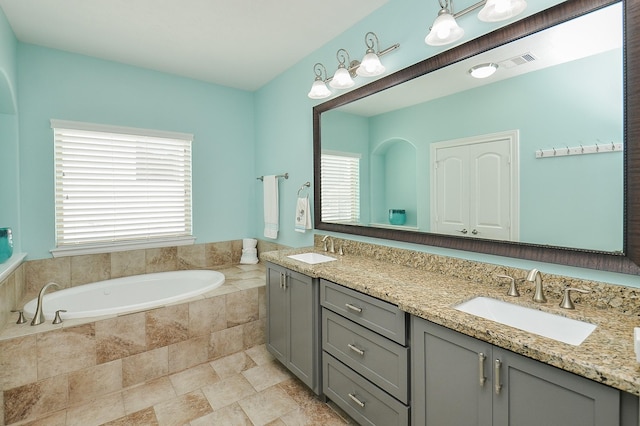 1913 Rosewood St, Houston, TX 77004 - full bath featuring a garden tub and double vanity