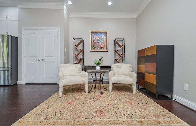 1913 Rosewood St, Houston, TX 77004 - sitting room featuring dark wood-type flooring, ornamental molding, recessed lighting, and baseboards