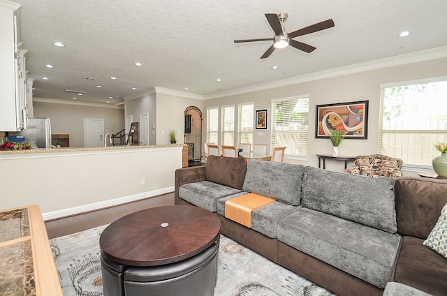 1913 Rosewood St, Houston, TX 77004 - living area featuring recessed lighting, healthy amount of natural light, a ceiling fan, wood finished floors, and baseboards