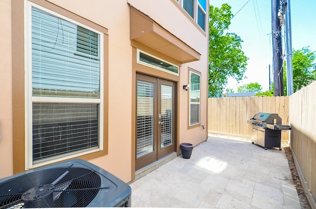 1913 Rosewood St, Houston, TX 77004 - view of patio / terrace featuring french doors, central AC, and a grill