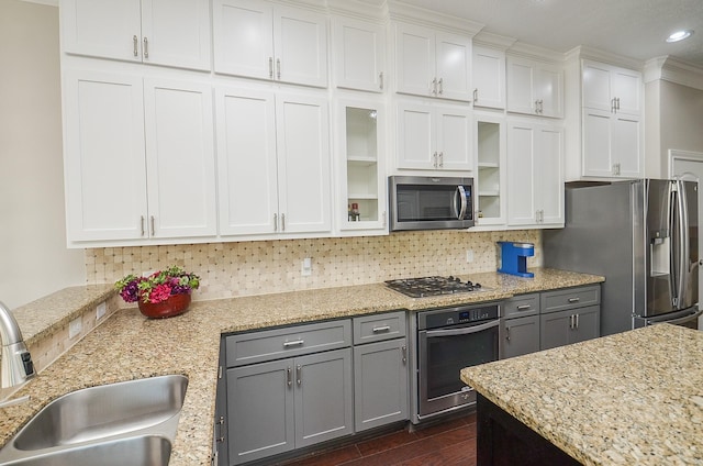 1913 Rosewood St, Houston, TX 77004 - kitchen with appliances with stainless steel finishes, a sink, glass insert cabinets, white cabinetry, and recessed lighting