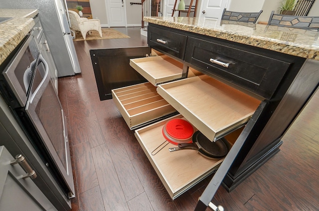 1913 Rosewood St, Houston, TX 77004 - kitchen featuring dark wood-type flooring and light stone countertops