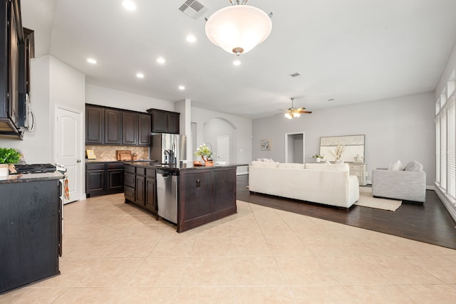 2314 Laurel Loch Ln, Pearland, TX 77584 - kitchen featuring arched walkways, stainless steel appliances, a ceiling fan, open floor plan, and recessed lighting