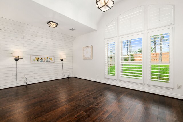 2314 Laurel Loch Ln, Pearland, TX 77584 - unfurnished living room with healthy amount of natural light, dark wood-type flooring, baseboards, and vaulted ceiling