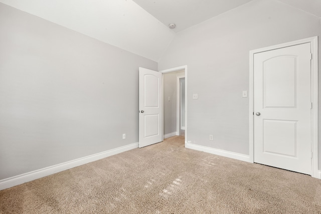 2314 Laurel Loch Ln, Pearland, TX 77584 - unfurnished bedroom with lofted ceiling, light colored carpet, and baseboards