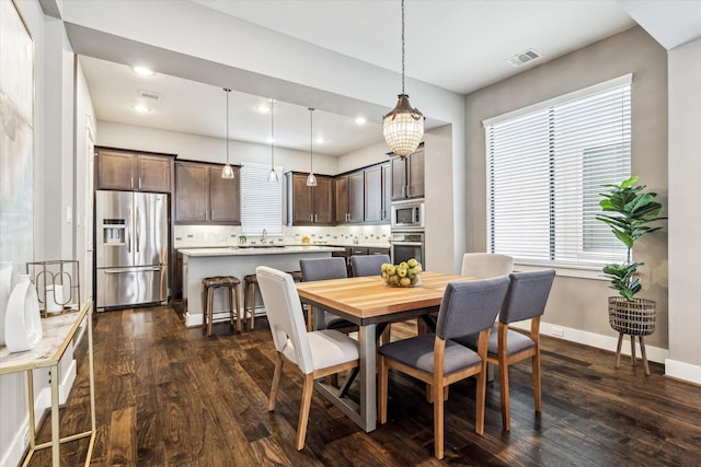 783 Waverly St, Houston, TX 77007 - dining room featuring dark wood-type flooring, baseboards, plenty of natural light, and recessed lighting