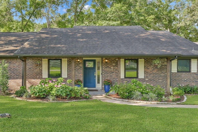 914 Rustic Oaks Dr, Magnolia, TX 77354 - view of front of home featuring brick siding, a shingled roof, and a front yard