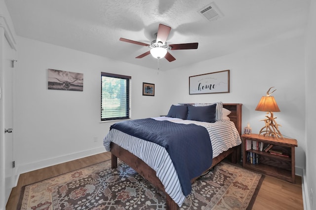 914 Rustic Oaks Dr, Magnolia, TX 77354 - bedroom featuring wood finished floors, baseboards, and a ceiling fan