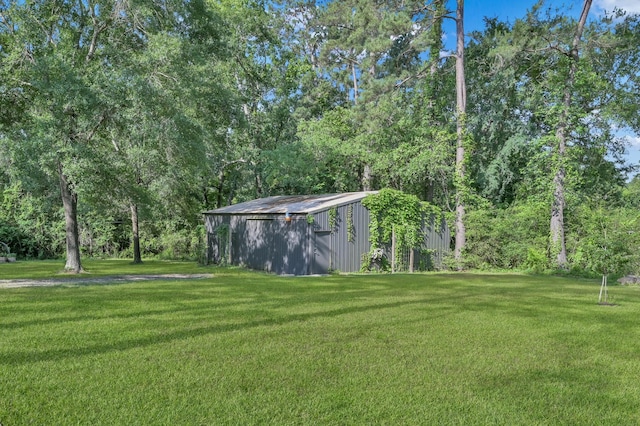 914 Rustic Oaks Dr, Magnolia, TX 77354 - view of grassy yard featuring a pole building and an outdoor structure