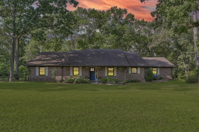 914 Rustic Oaks Dr, Magnolia, TX 77354 - ranch-style house with a front lawn, brick siding, and roof with shingles