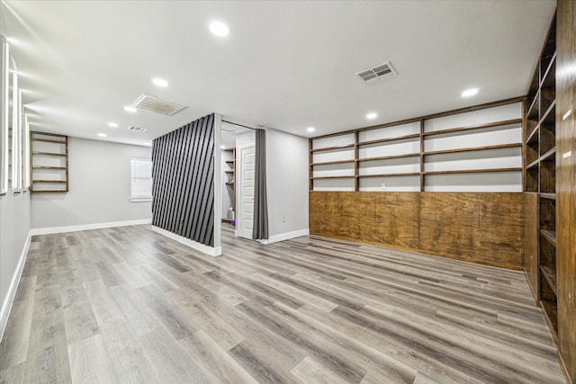 2106 Antoine Dr, Houston, TX 77055 - basement with wood finished floors, baseboards, and recessed lighting