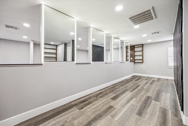 2106 Antoine Dr, Houston, TX 77055 - spare room featuring baseboards, wood finished floors, and recessed lighting