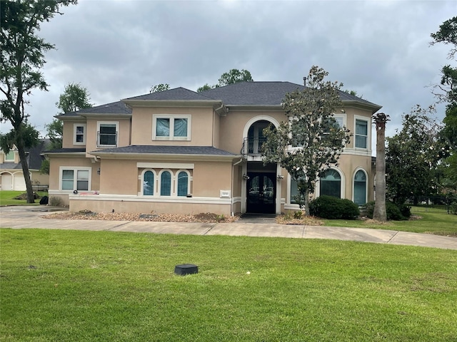 8930 Water Crest Trl, Richmond, TX 77469 - view of front of house featuring french doors, stucco siding, and a front yard