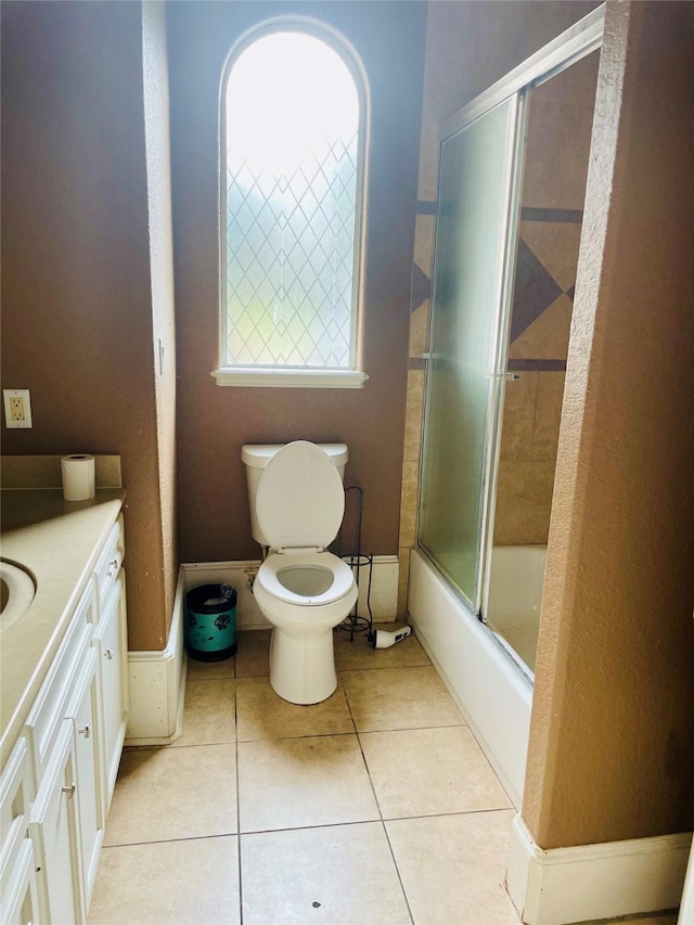8930 Water Crest Trl, Richmond, TX 77469 - bathroom featuring toilet, tile patterned flooring, vanity, and combined bath / shower with glass door