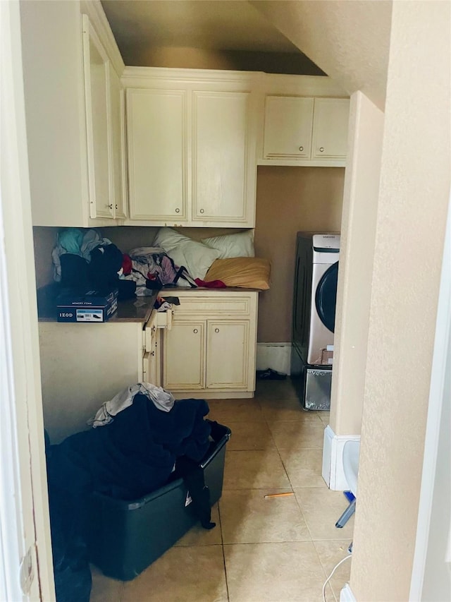 8930 Water Crest Trl, Richmond, TX 77469 - kitchen with light tile patterned floors, independent washer and dryer, and cream cabinets