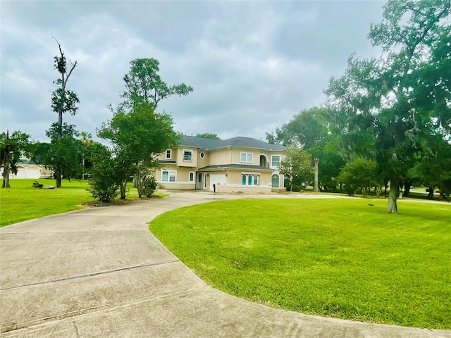 8930 Water Crest Trl, Richmond, TX 77469 - view of front facade featuring concrete driveway, a front yard, stucco siding, and a garage