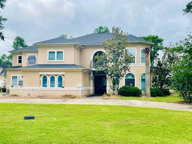 8930 Water Crest Trl, Richmond, TX 77469 - view of front of home with stucco siding and a front yard