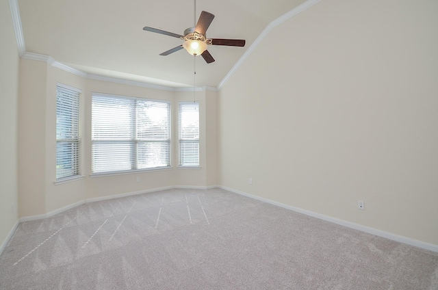 unfurnished room featuring vaulted ceiling, light carpet, a ceiling fan, baseboards, and ornamental molding