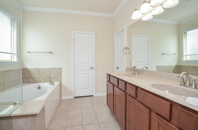 bathroom with a garden tub, healthy amount of natural light, tile patterned floors, double vanity, and ornamental molding