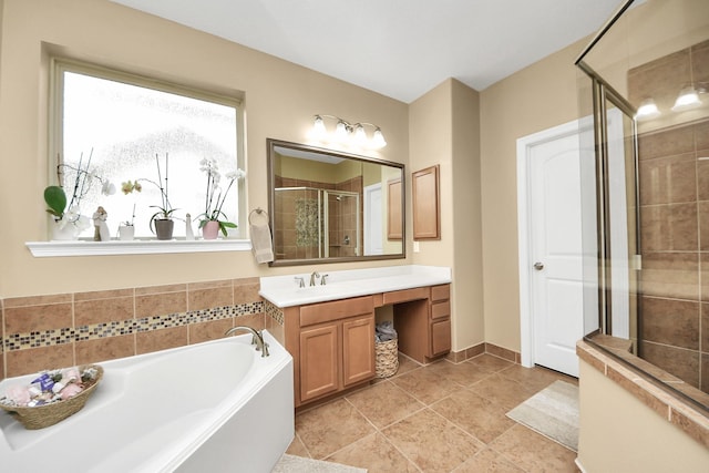 full bath featuring a shower stall, a garden tub, and vanity