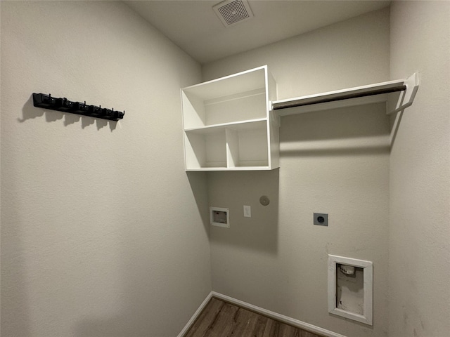 washroom featuring electric dryer hookup, dark wood-style flooring, baseboards, and washer hookup