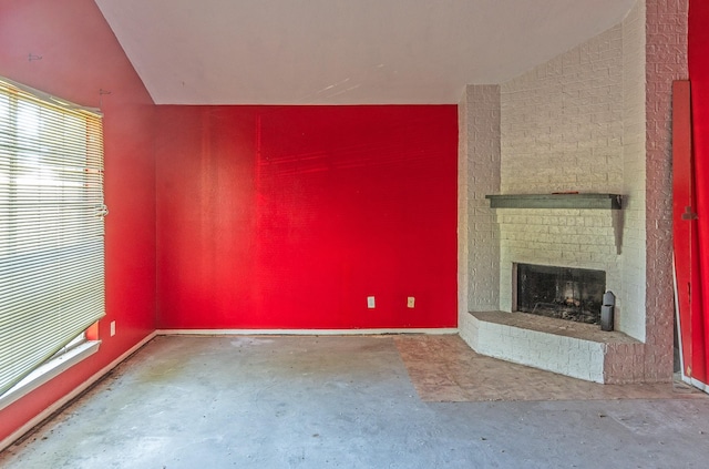 9118 Nyssa St, Houston, TX 77078 - unfurnished living room featuring unfinished concrete flooring and a fireplace