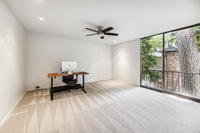 carpeted home office with baseboards, a ceiling fan, recessed lighting, and expansive windows
