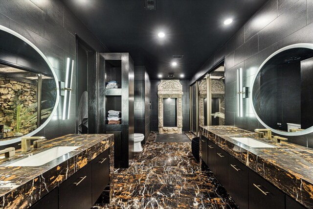 bathroom featuring two vanities