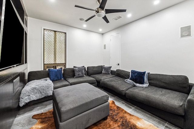 living area with recessed lighting and a ceiling fan