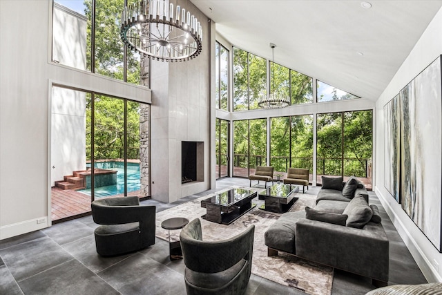 sunroom featuring a chandelier and vaulted ceiling
