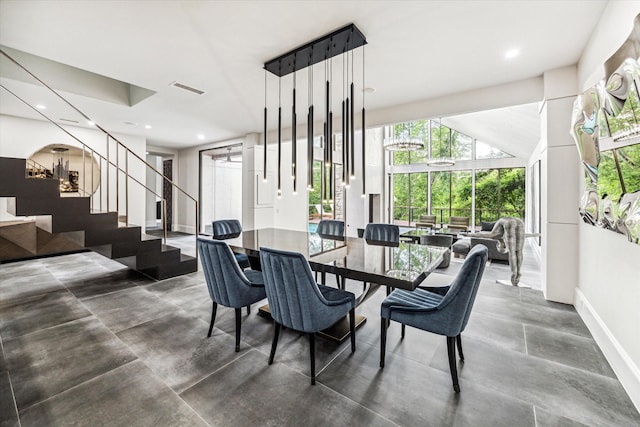 dining area with baseboards, stairs, and recessed lighting