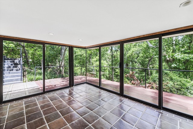 unfurnished sunroom featuring healthy amount of natural light