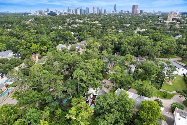 aerial view of property's location featuring a skyline view