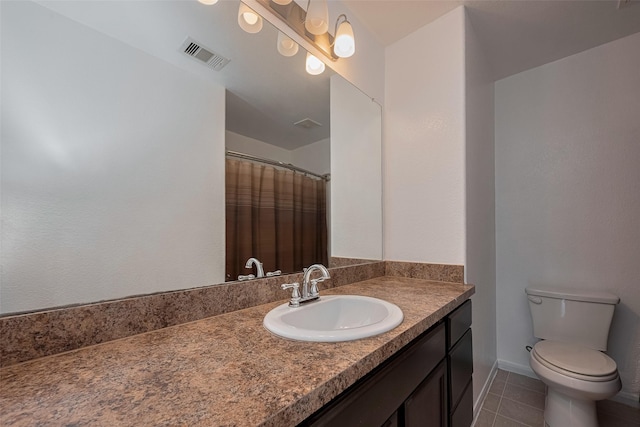 full bathroom featuring tile patterned flooring, toilet, vanity, and curtained shower