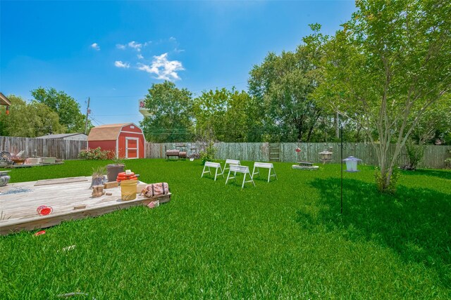 view of yard featuring a storage shed and an outdoor structure