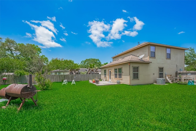 back of house with central AC unit and a patio