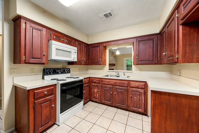 kitchen with white microwave, range with electric cooktop, a sink, light tile patterned floors, and light countertops