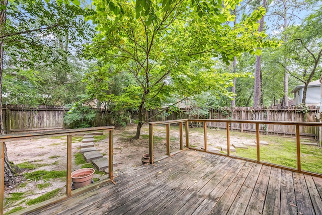 deck with a fenced backyard