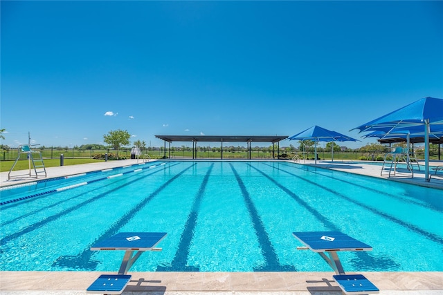 community pool featuring fence