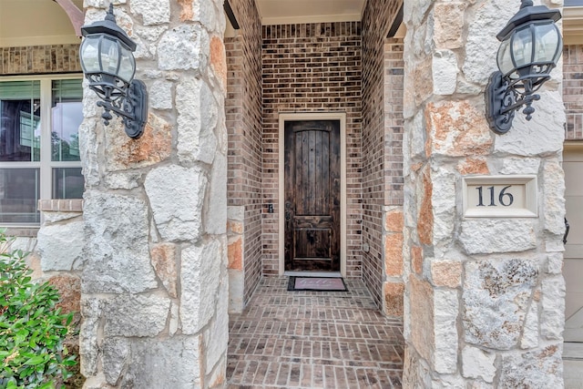 116 Brighton Woods Ct, Conroe, TX 77318 - property entrance featuring brick siding and stone siding