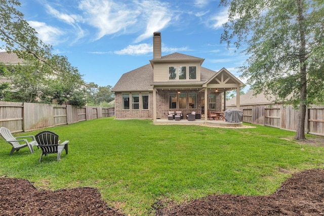 116 Brighton Woods Ct, Conroe, TX 77318 - back of house featuring a chimney, a patio area, brick siding, a ceiling fan, and roof with shingles