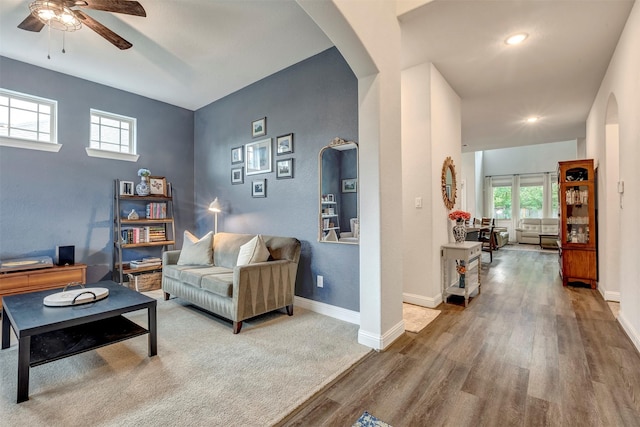 116 Brighton Woods Ct, Conroe, TX 77318 - living room with wood finished floors, arched walkways, ceiling fan, healthy amount of natural light, and recessed lighting