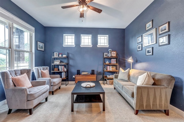 116 Brighton Woods Ct, Conroe, TX 77318 - living room featuring plenty of natural light, light colored carpet, and a ceiling fan